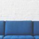 Blue couch with white wall